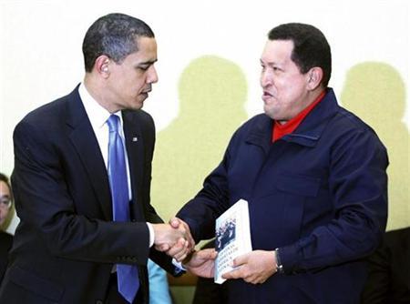Venezuelan President Hugo Chavez gives U.S. President Barack Obama a copy of "Las Venas Abiertas de America Latina" by author Eduardo Galeano during a meeting at the Summit of the Americas in Port of Spain, Trinidad April 18, 2009. REUTERS/Kevin Lamarque